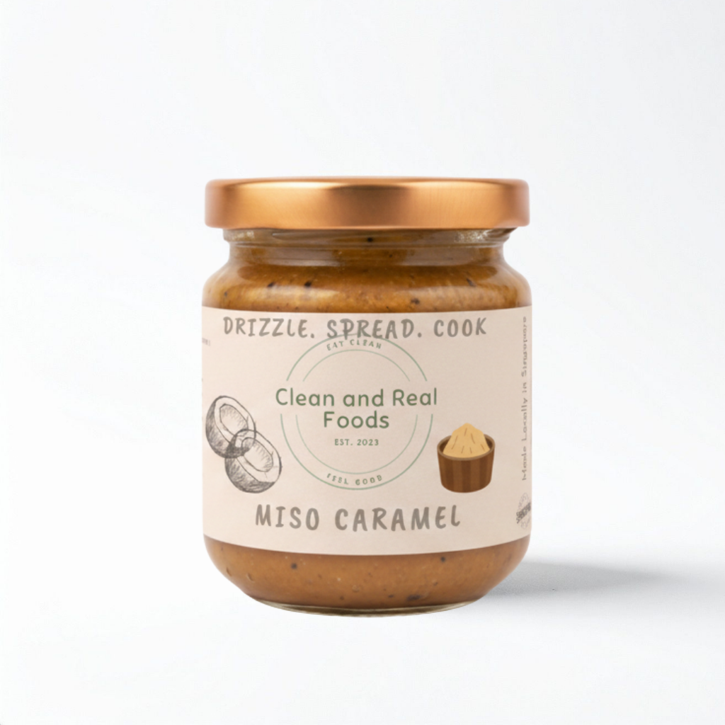Jar of 160-g Miso Caramel with 'Clean and Real Foods' label on a white background.