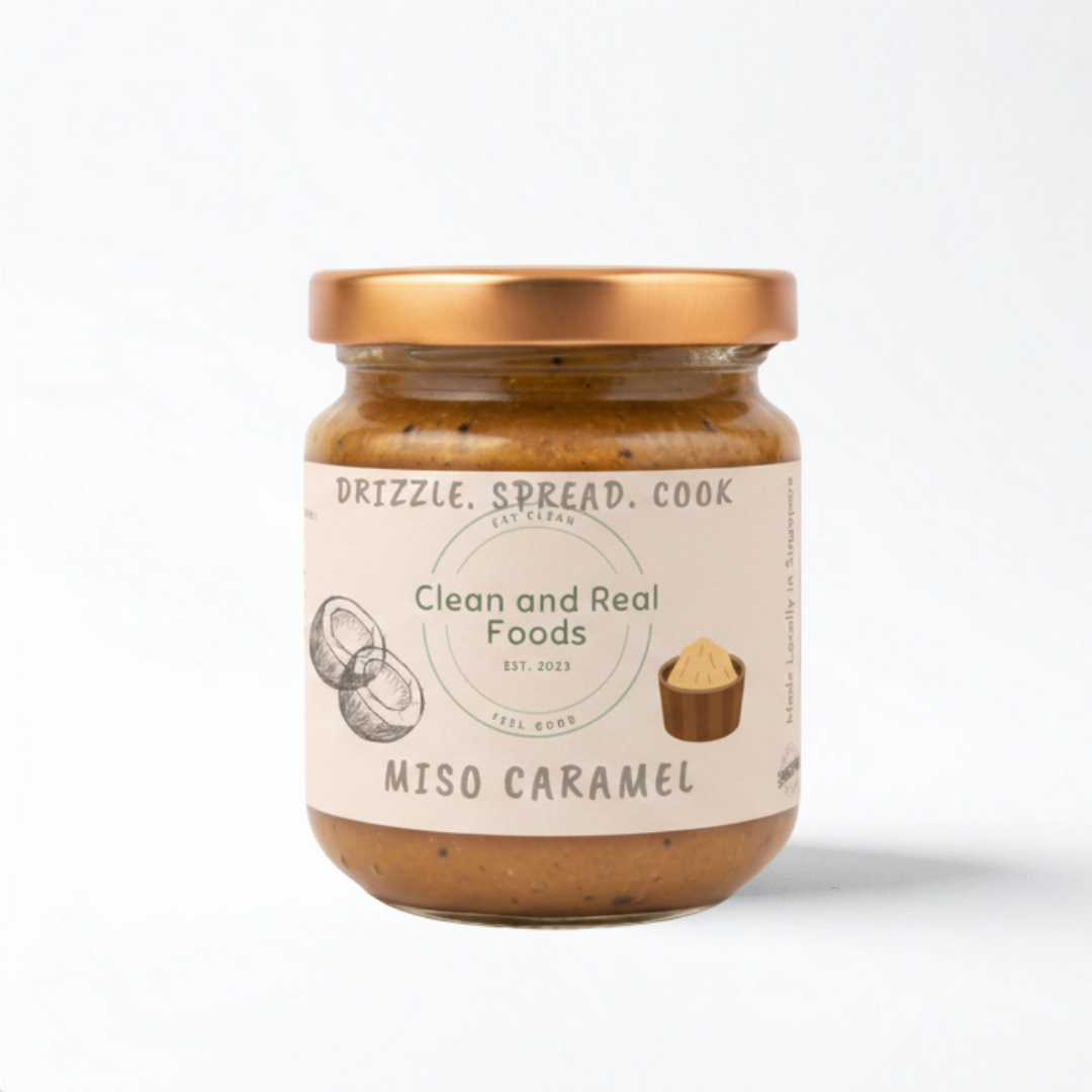 Jar of 160-g Miso Caramel with 'Clean and Real Foods' label on a white background.